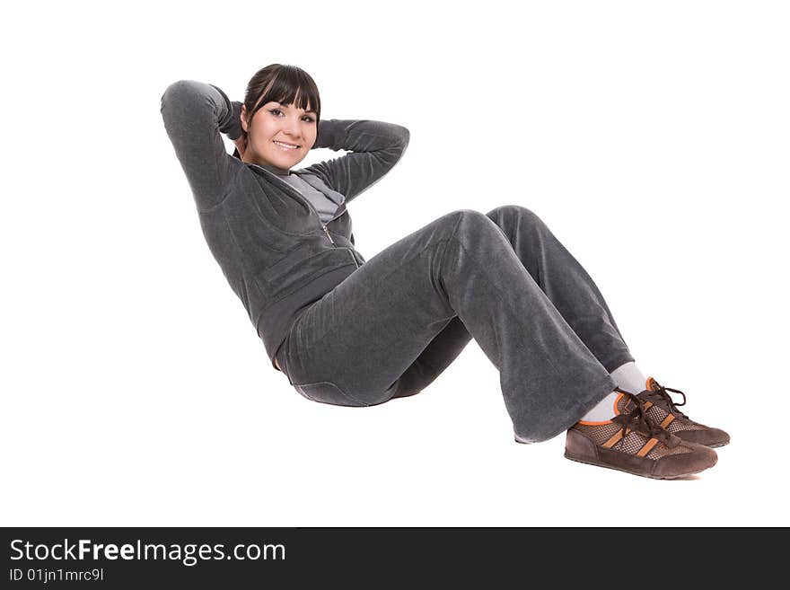 Attractive brunette woman doing exercise. over white background