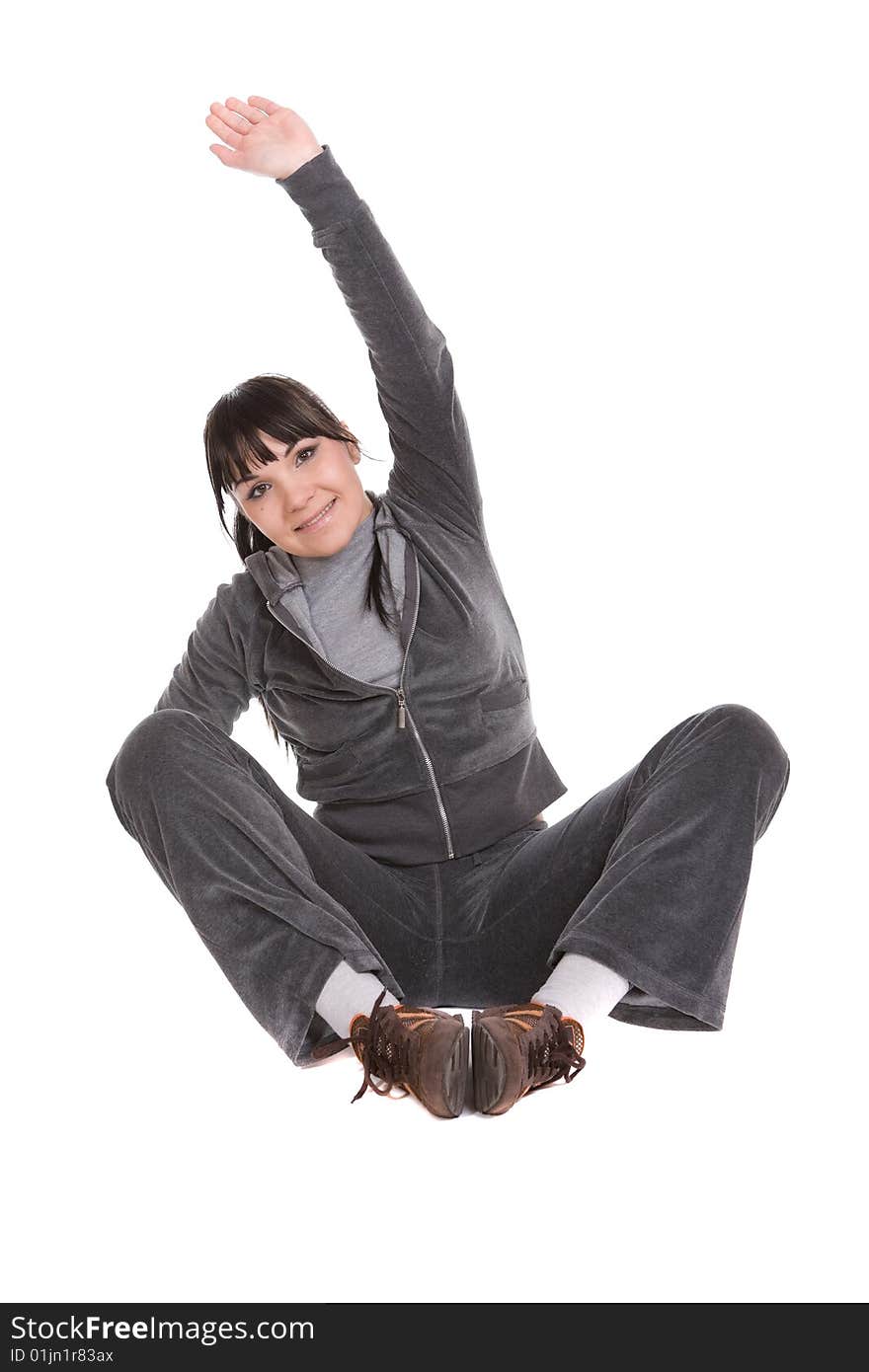 Attractive brunette woman doing exercise. over white background