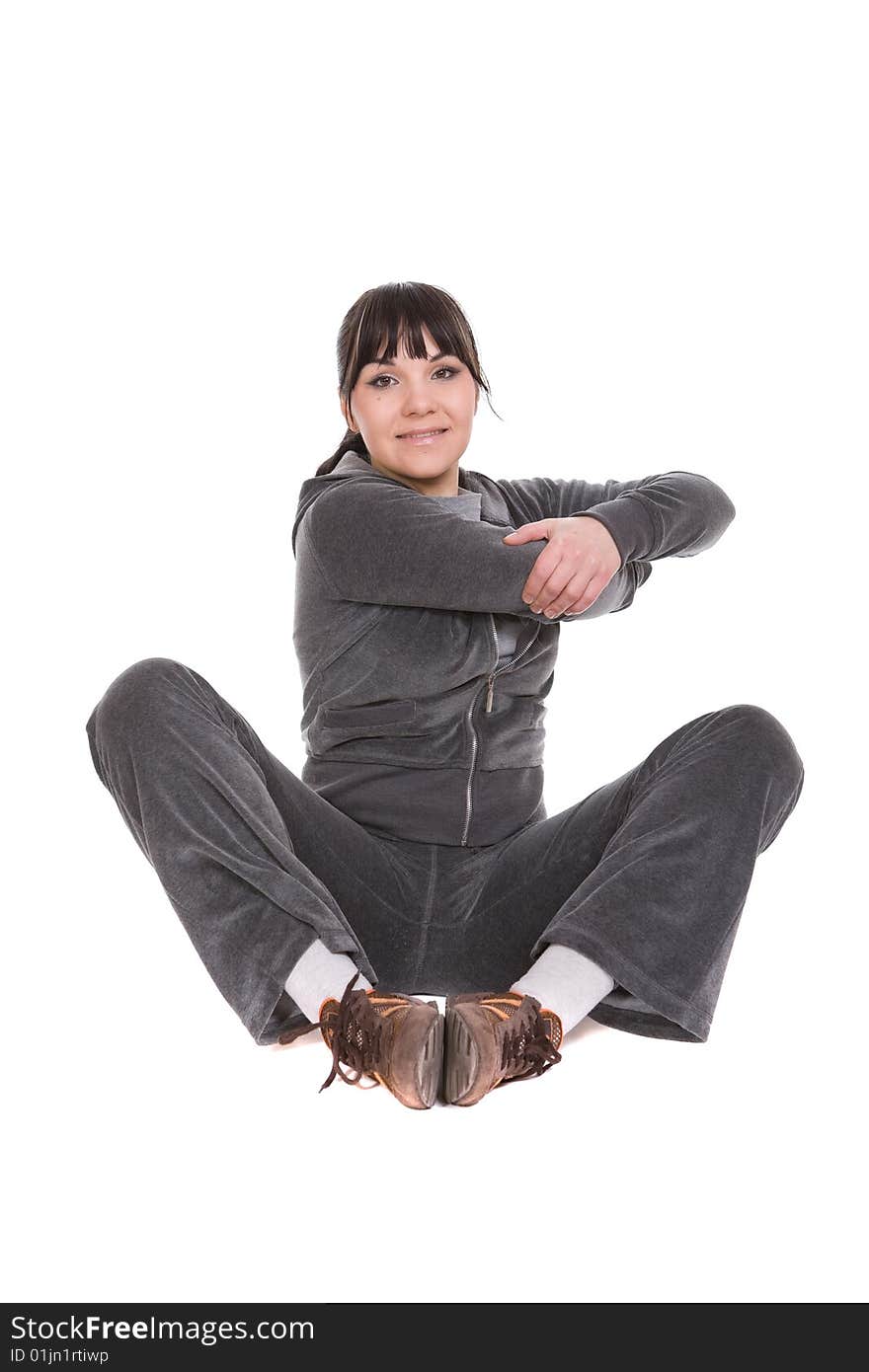 Attractive brunette woman doing exercise. over white background