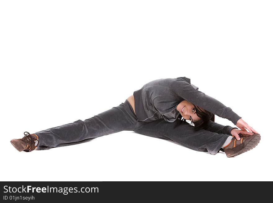 Attractive brunette woman doing exercise. over white background