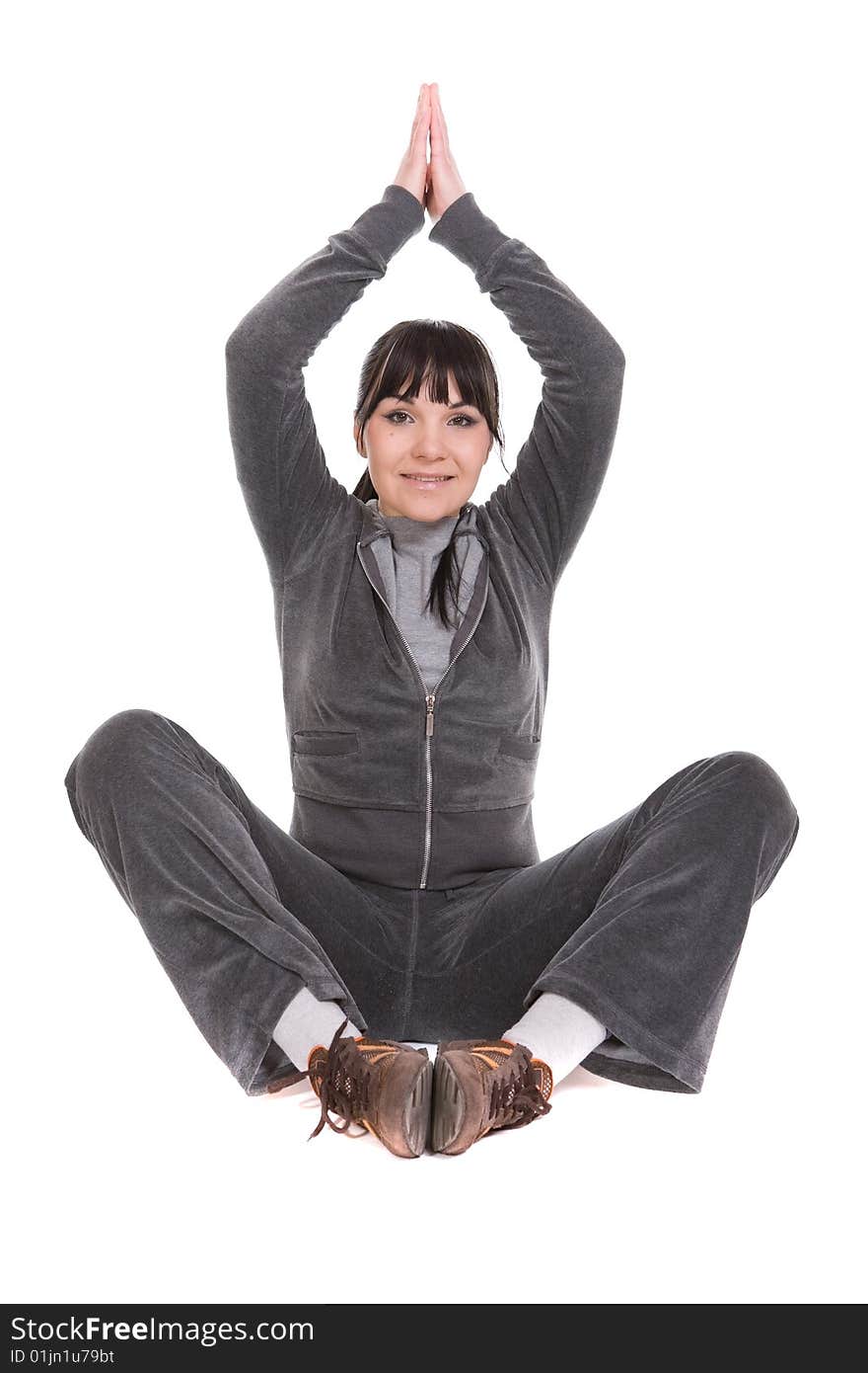 Attractive brunette woman doing exercise. over white background