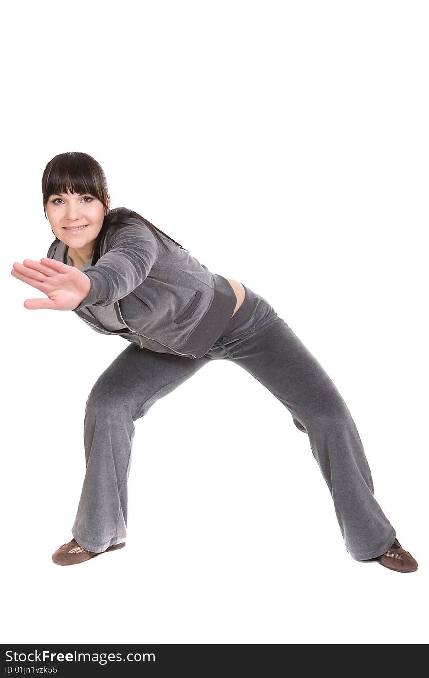 Attractive brunette woman doing exercise. over white background