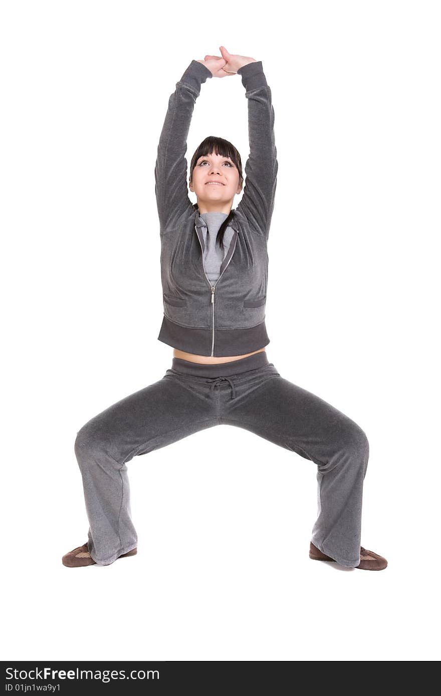 Attractive brunette woman doing exercise. over white background