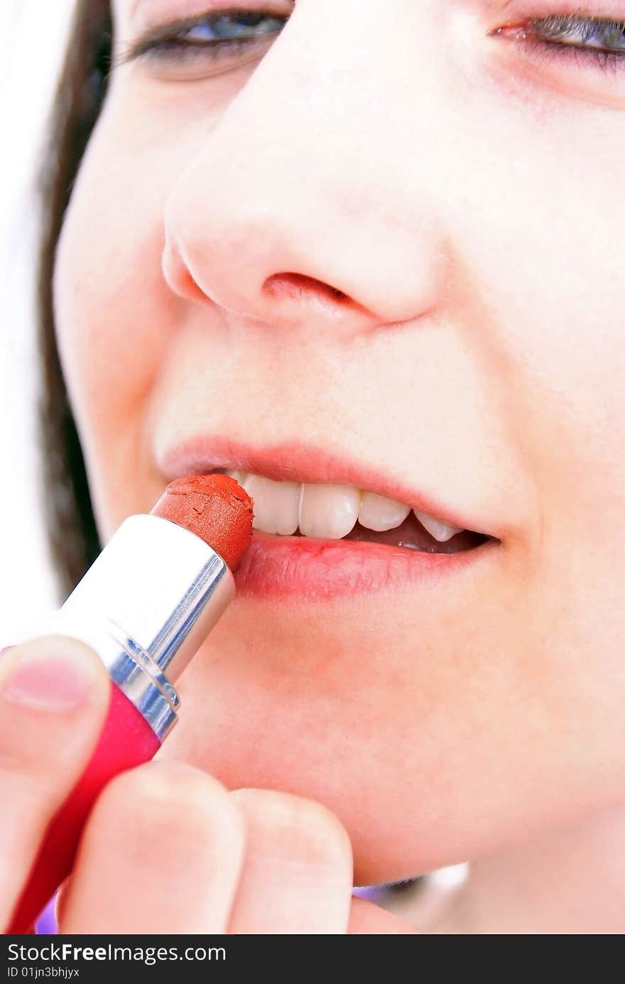 High Key Studio Shot of a mysterios brunette girl with lipstick. High Key Studio Shot of a mysterios brunette girl with lipstick