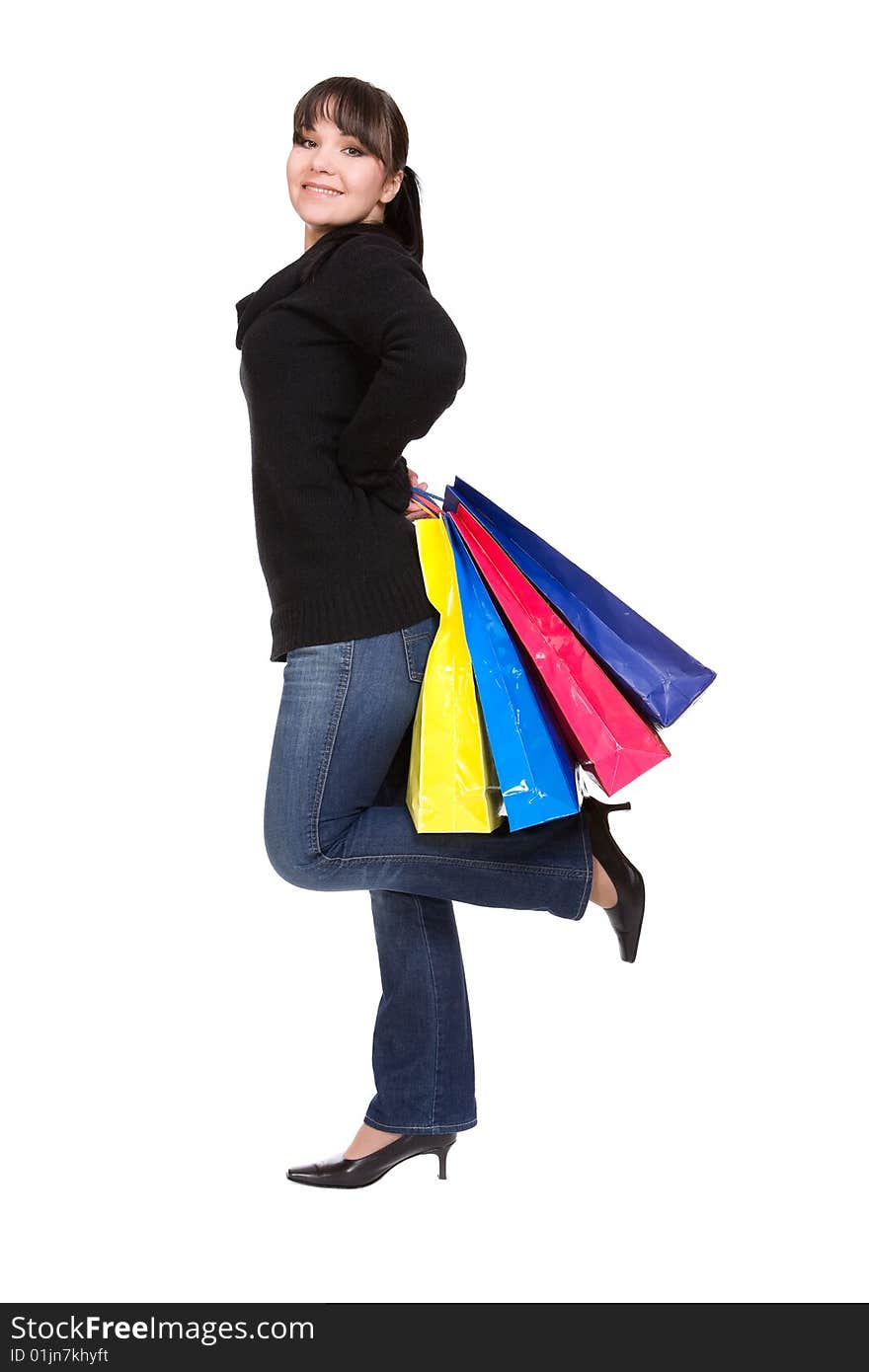 Happy woman with shopping bags. over white background