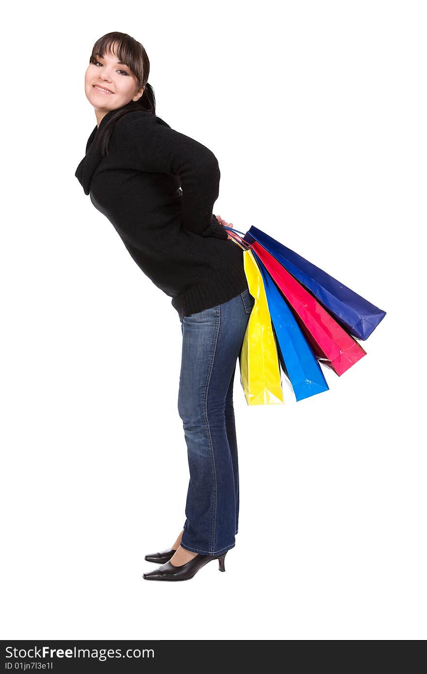 Happy woman with shopping bags. over white background