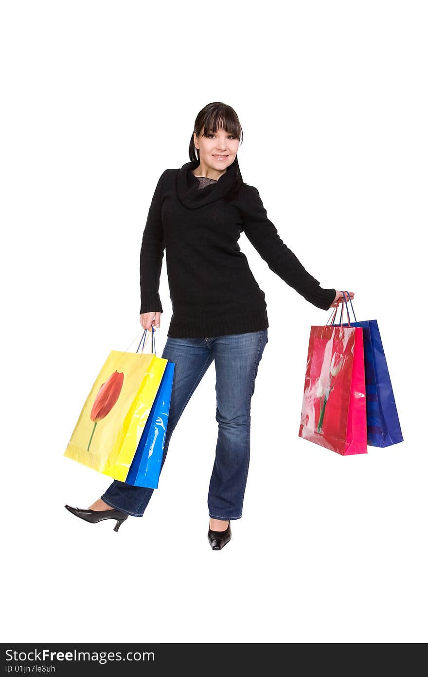 Happy woman with shopping bags. over white background