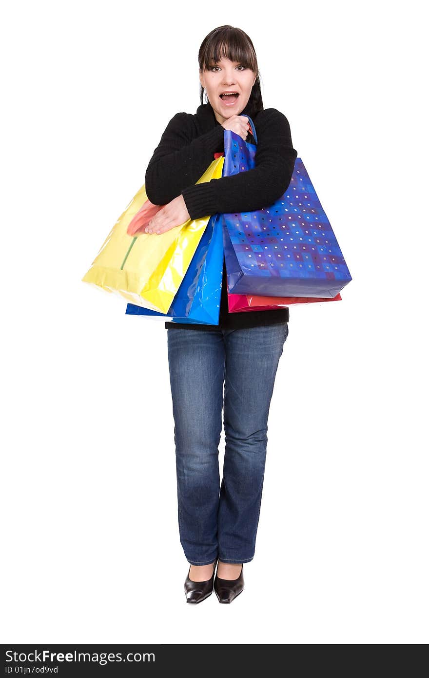 Happy woman with shopping bags. over white background