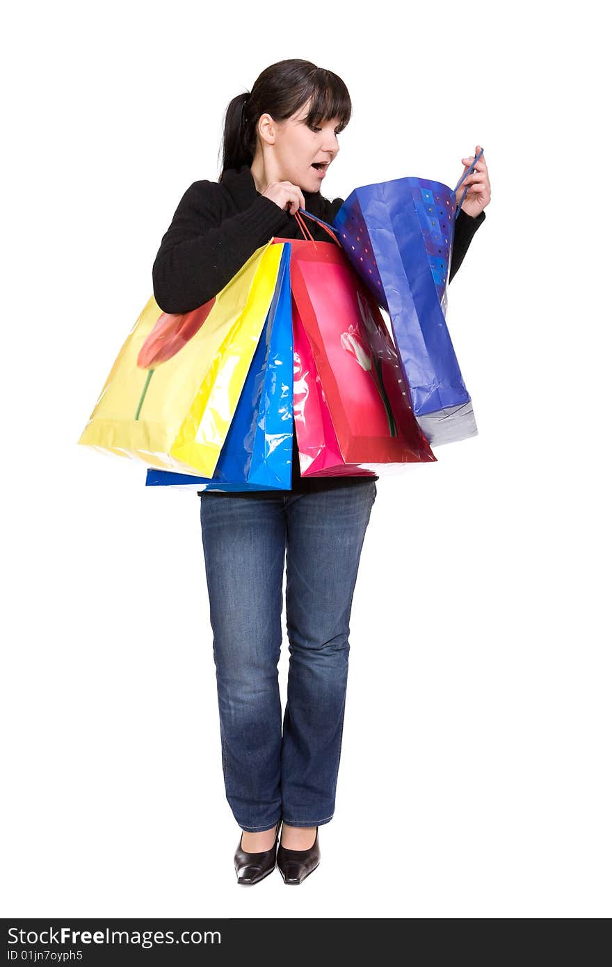 Happy woman with shopping bags. over white background