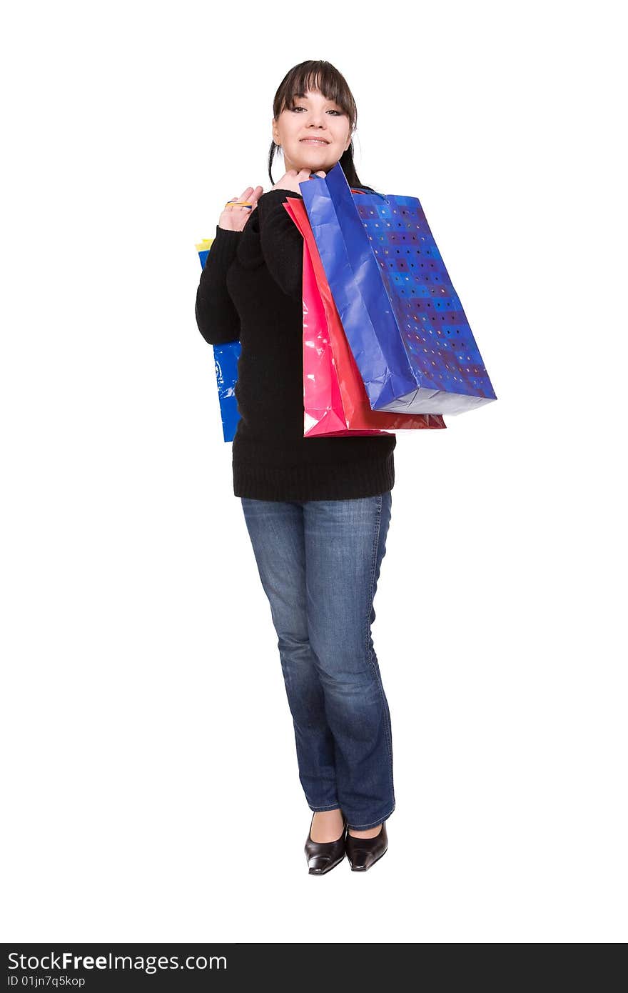 Happy woman with shopping bags. over white background