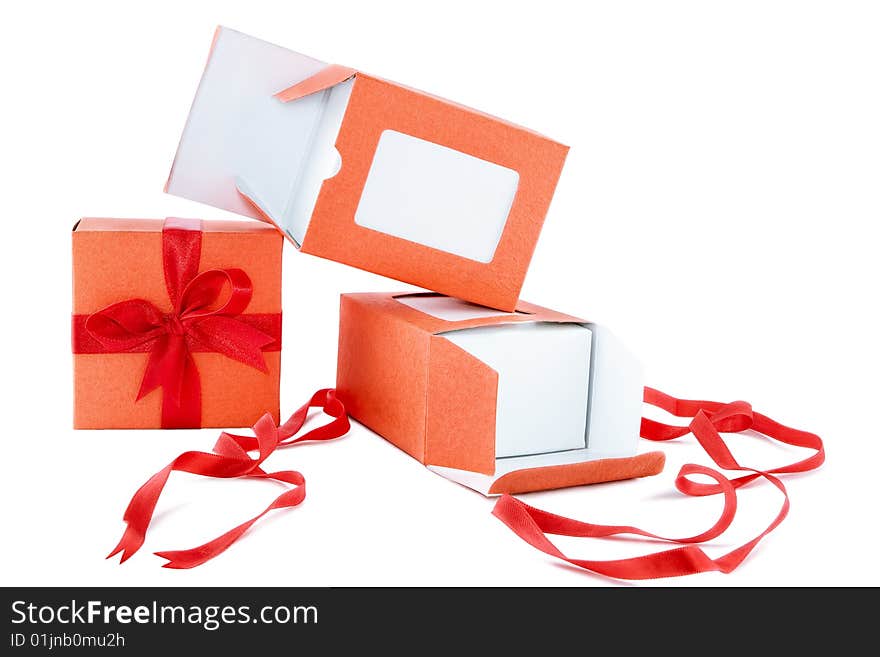 Orange box with red ribbon on white background