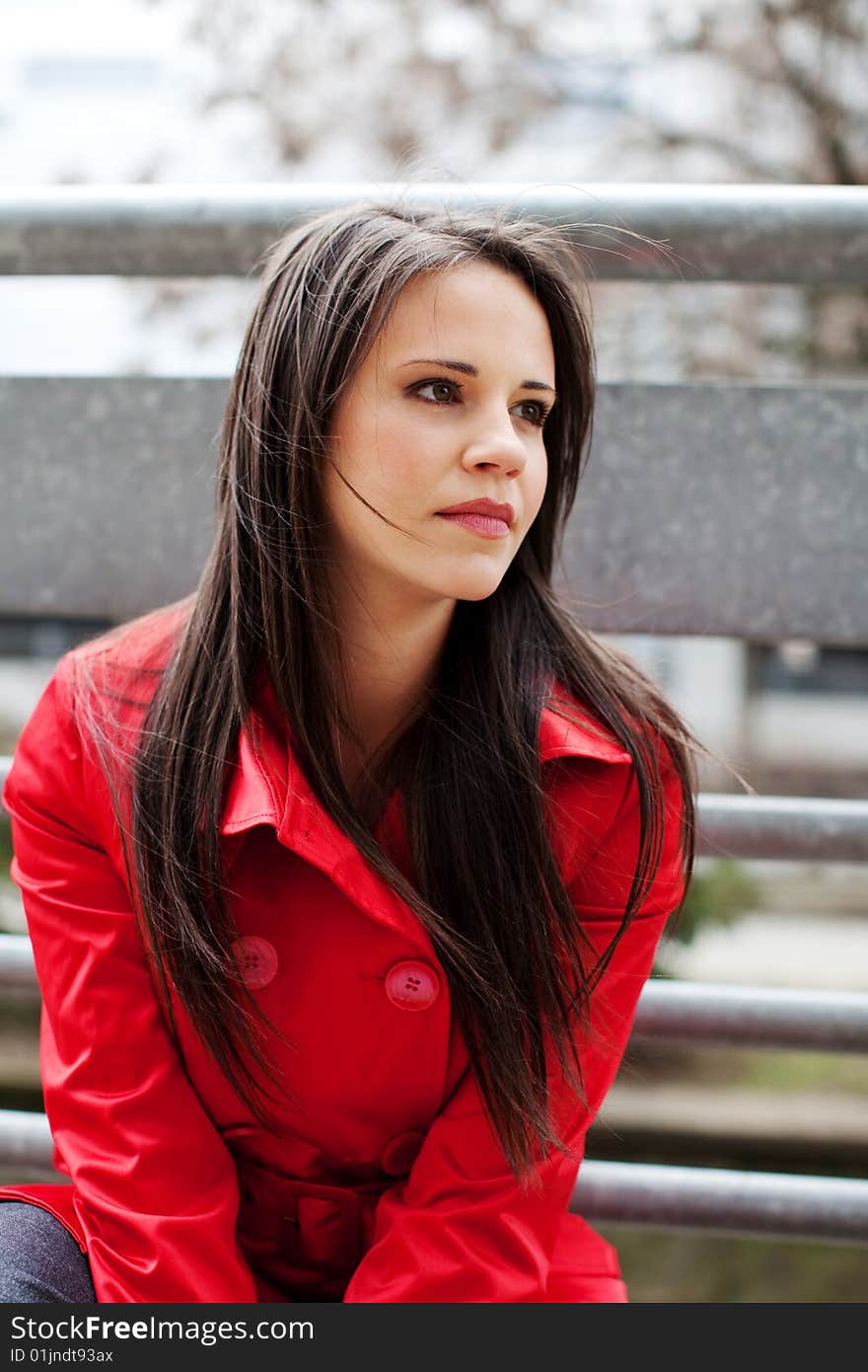 Beautiful young businesswoman in red coat. Beautiful young businesswoman in red coat