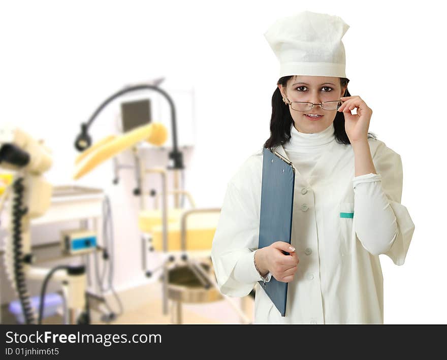 Beautiful young doctor on a background of a cabinet