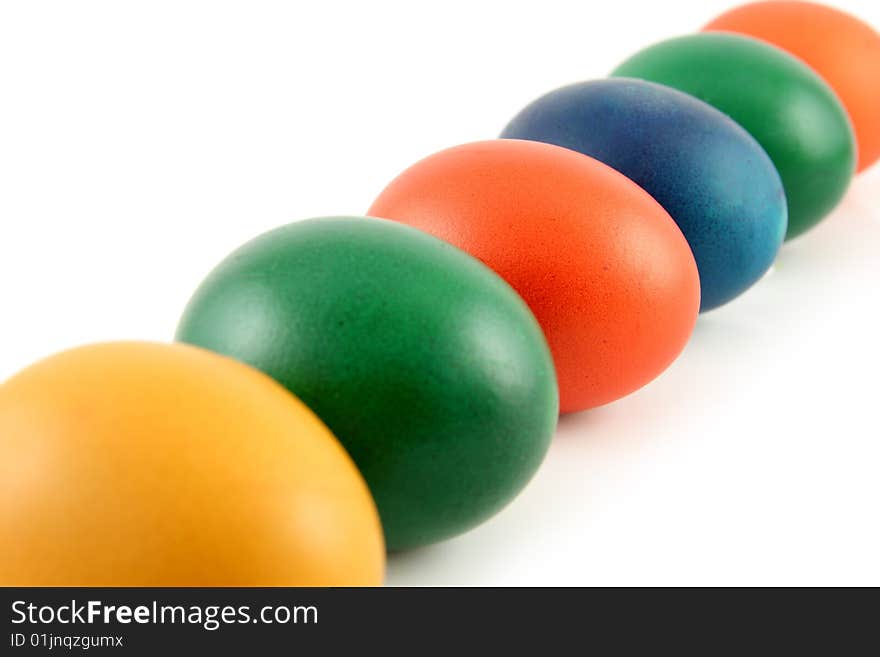 Six colored eggs isolated over white background. Six colored eggs isolated over white background