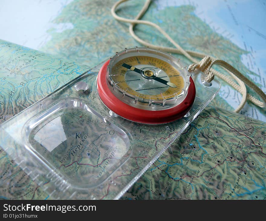 Map and compass with a magnifying glass