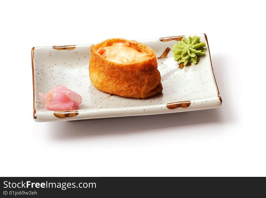 Sushi with salmon, cheese ginger in white squared plate over white background