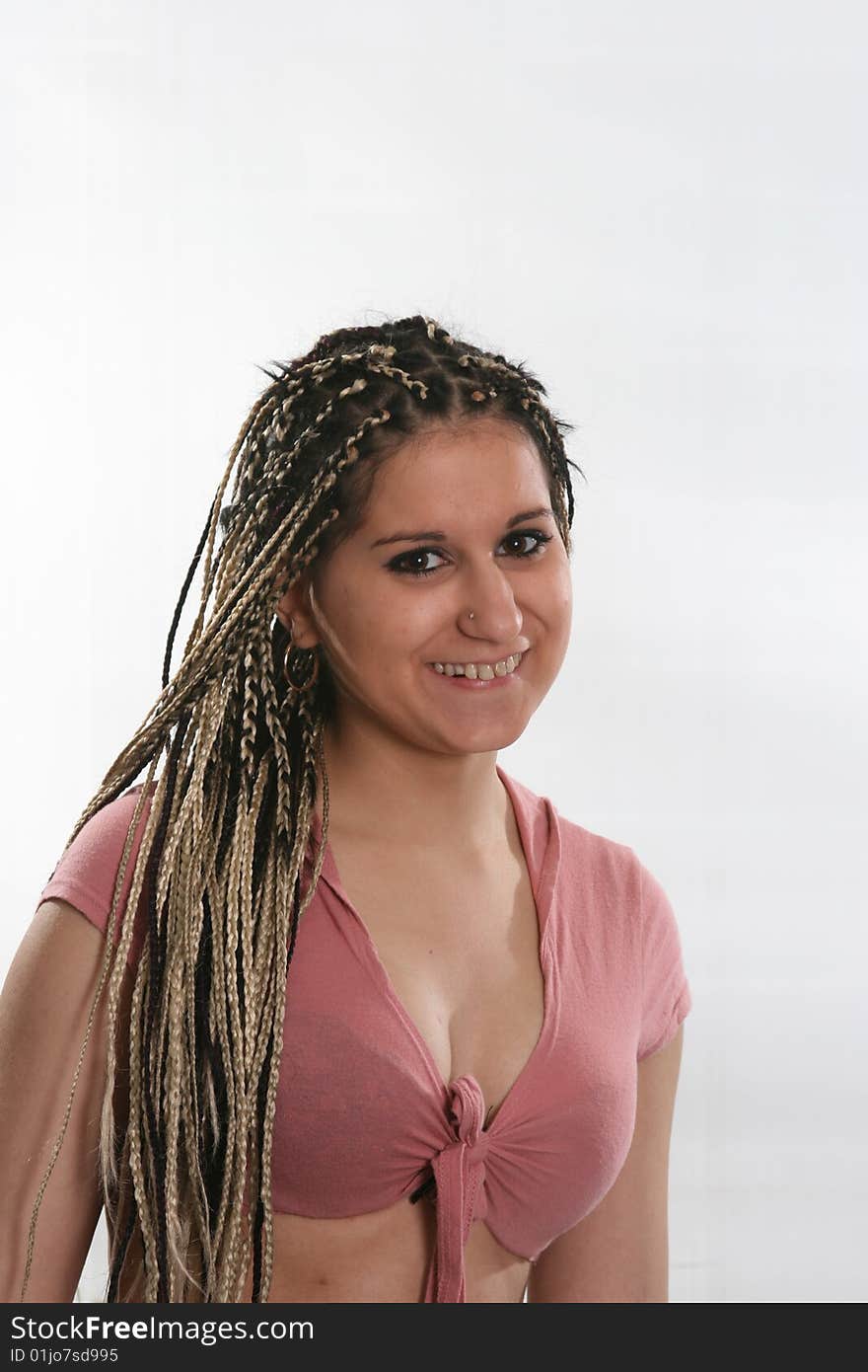 The nice girl with an ethnic dreadlocks hairdress. The nice girl with an ethnic dreadlocks hairdress