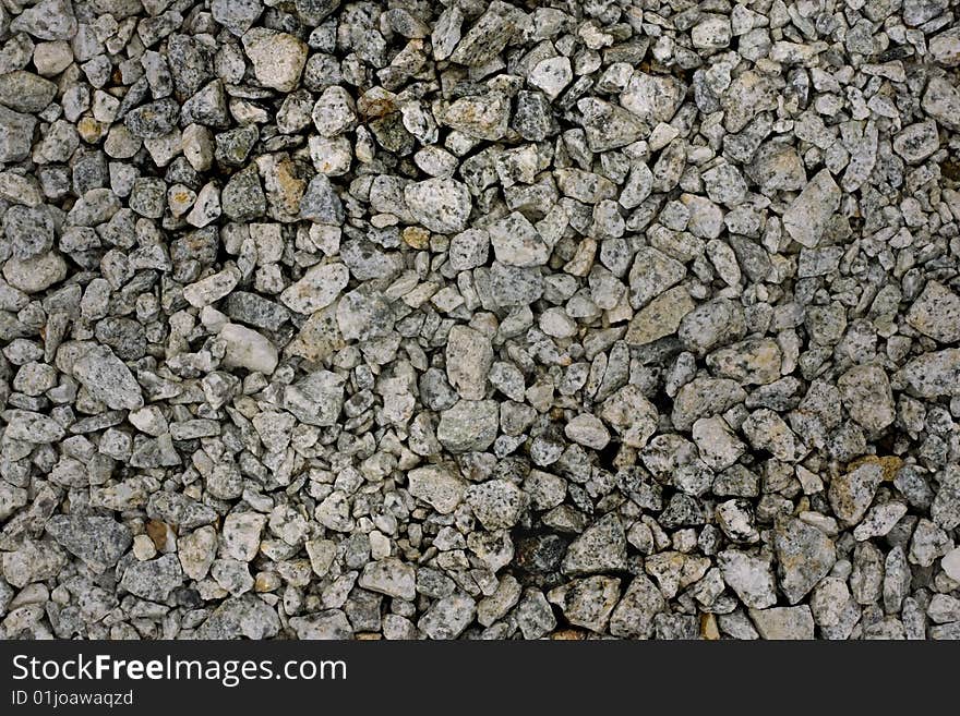 Pebbles of various sizes strewn from ignored grounds