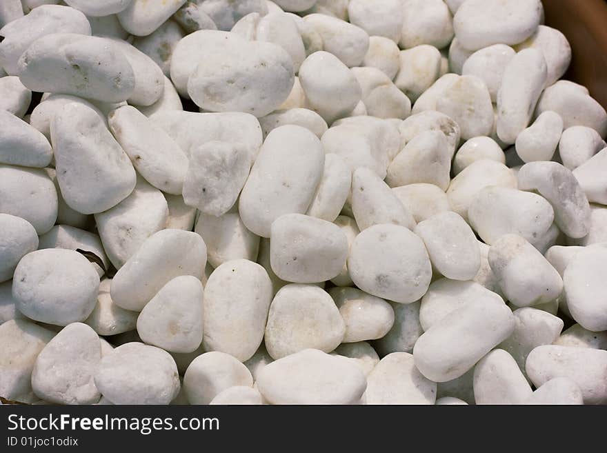 Whitewashed polished faces of white pebbles. Whitewashed polished faces of white pebbles