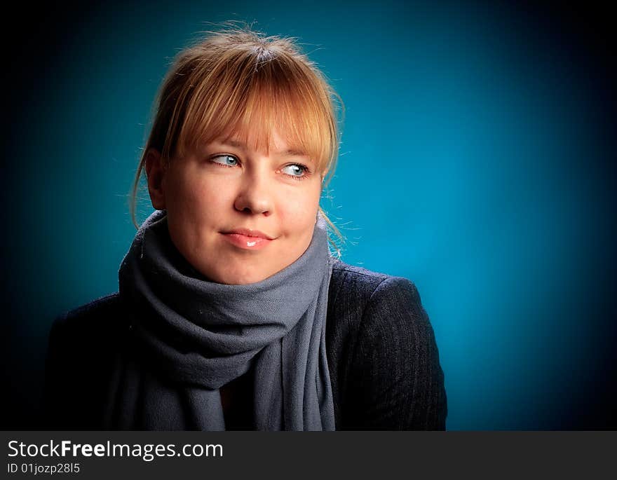 Portrait of female on a blue background in studio