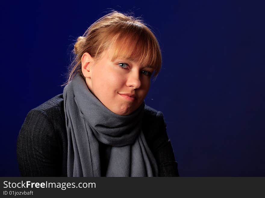 Portrait of female on a blue background in studio