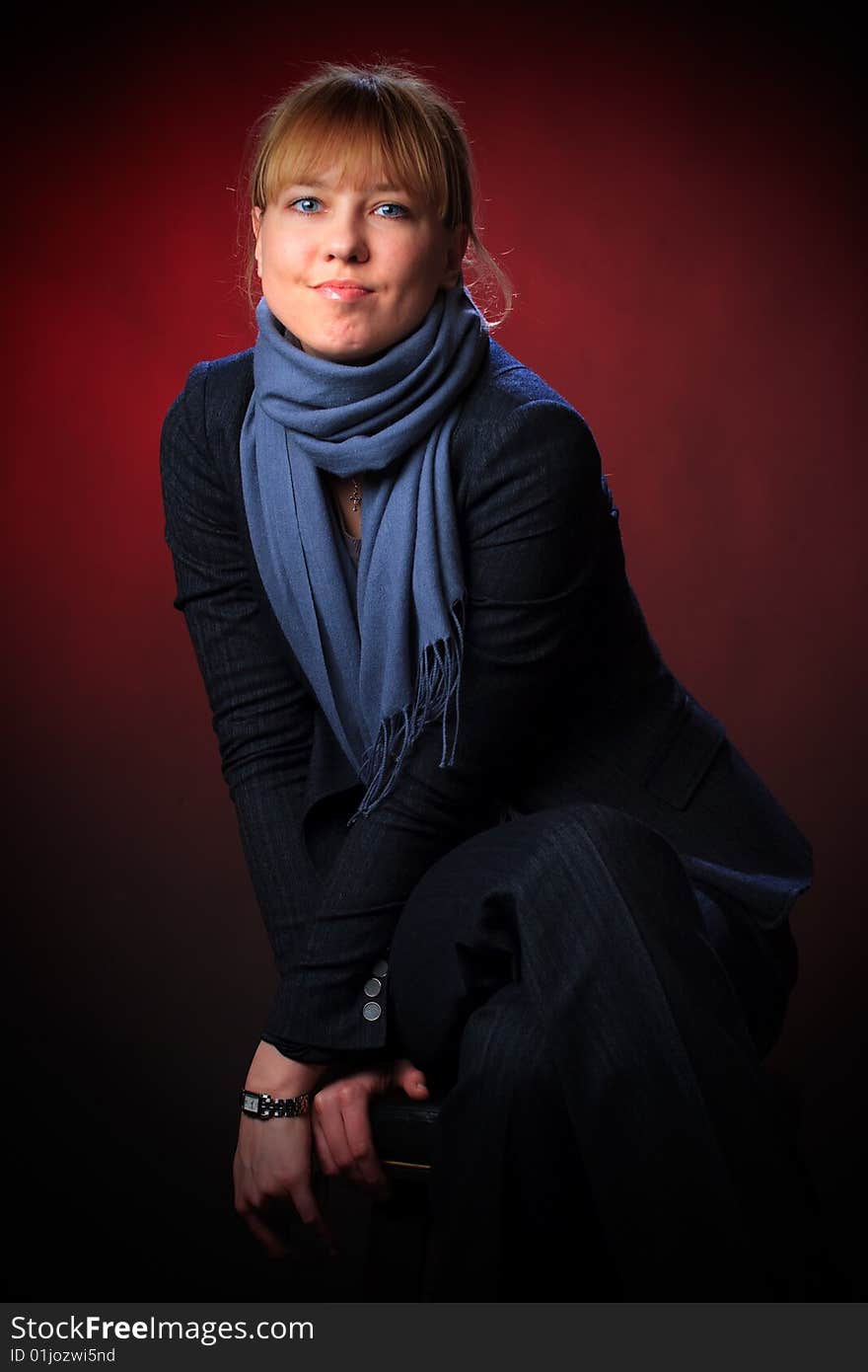 Portrait of female on a red background in studio