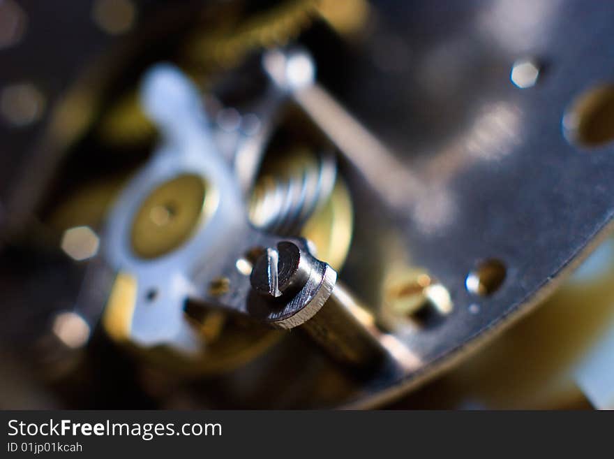 Cogs and wheels from the inside of an clock. Macro - low DOF.