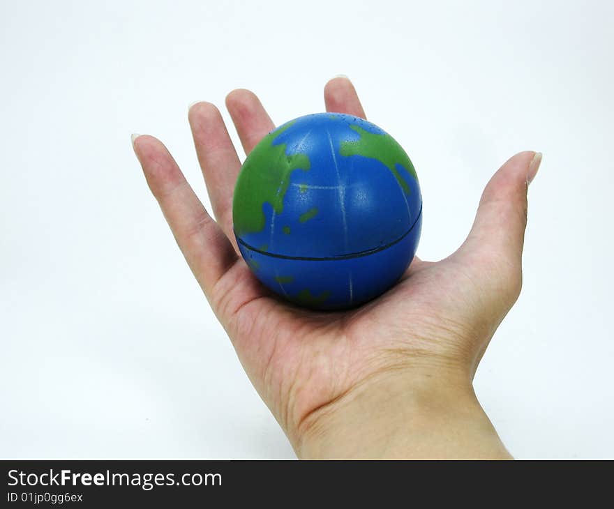 Toy earth in the palm of the hand. Toy earth in the palm of the hand