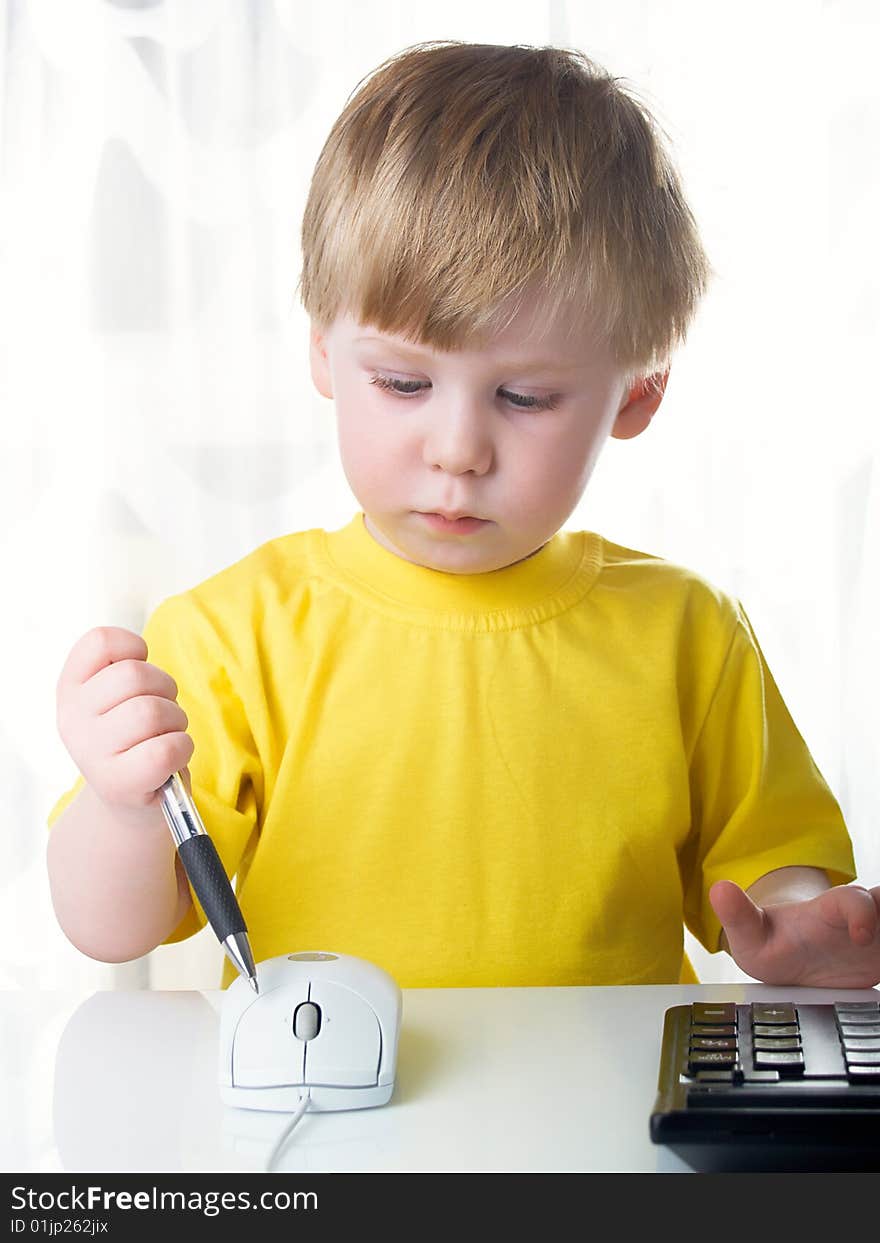 Little boy using a mouse on white background. Little boy using a mouse on white background