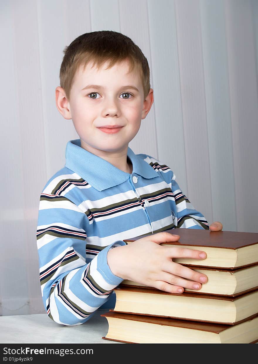 The child with books on the white