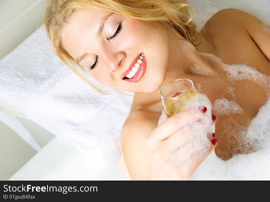 Young woman taking a bath