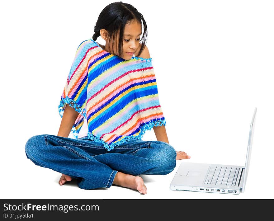 Girl sitting near a laptop isolated over white