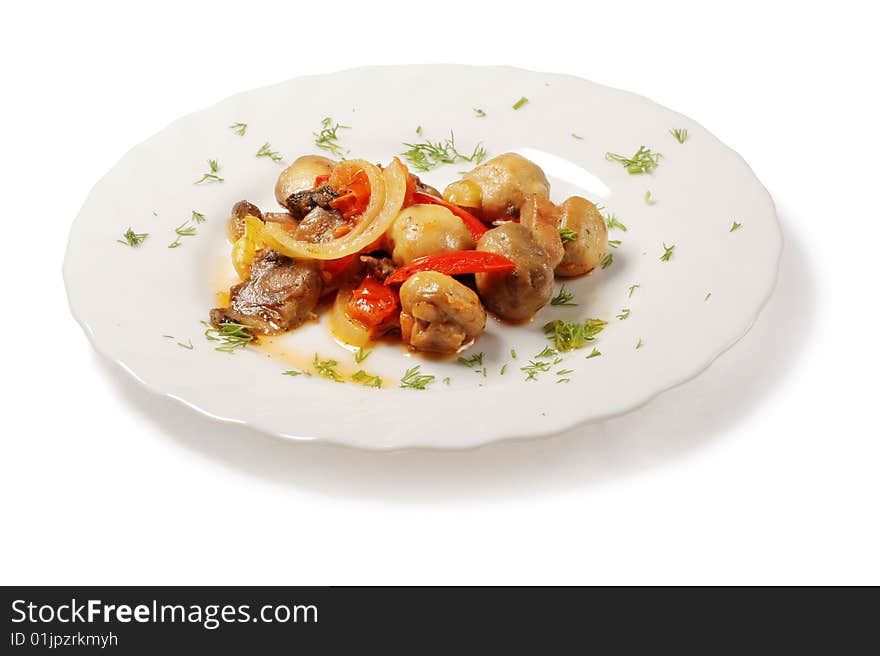 Savory mushrooms with pieces of onion, tomatoes and dill in white plate over white background