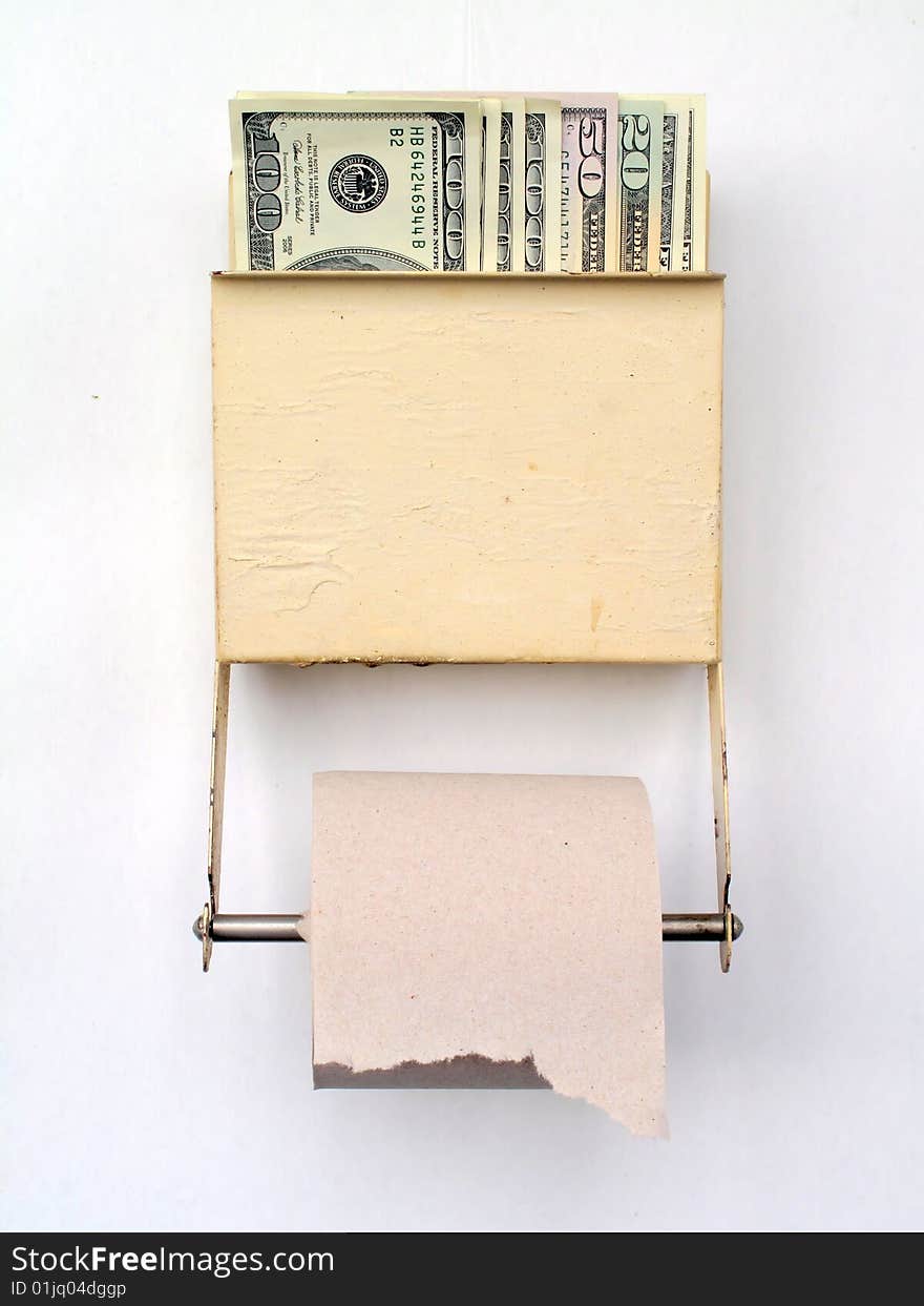 US dollars held in a tiolet paper dispenser. US dollars held in a tiolet paper dispenser