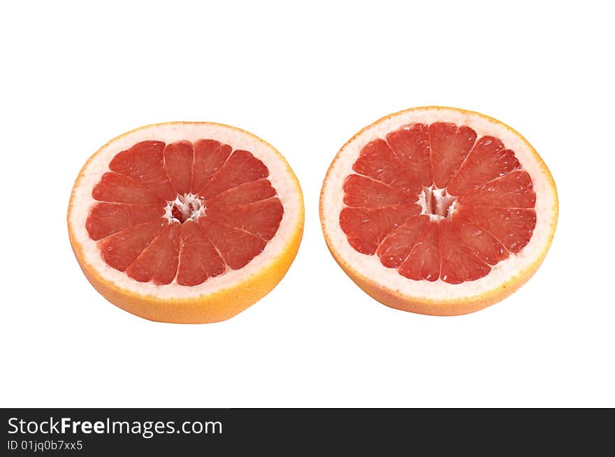 Juicy pieces of grapefruit on a white.