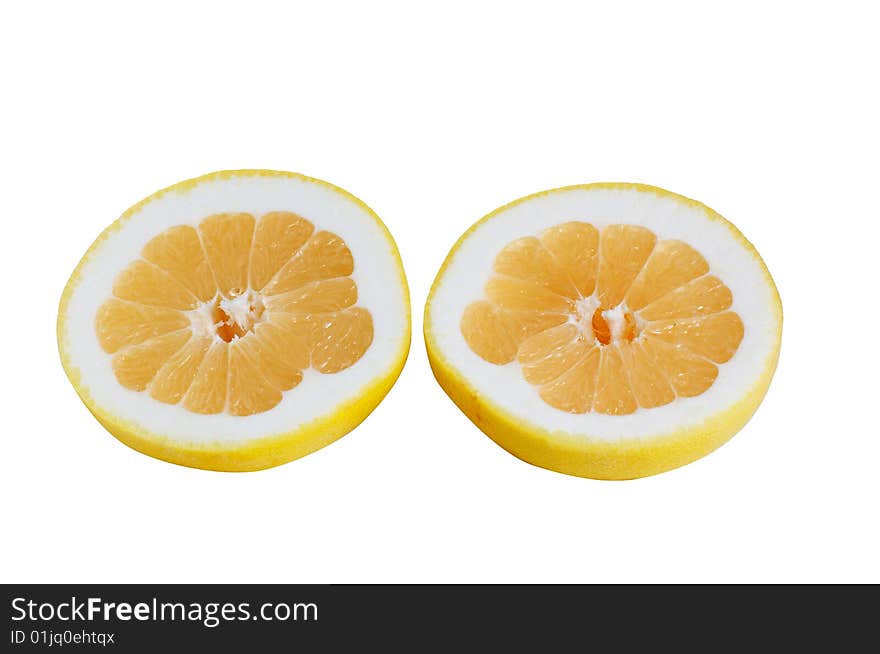 Slices of grapefruits on a white.