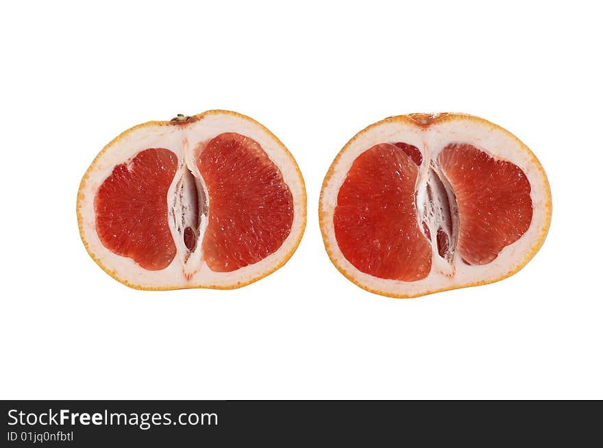 Two pieces of juicy grapefruit isolated on a white background. Two pieces of juicy grapefruit isolated on a white background.