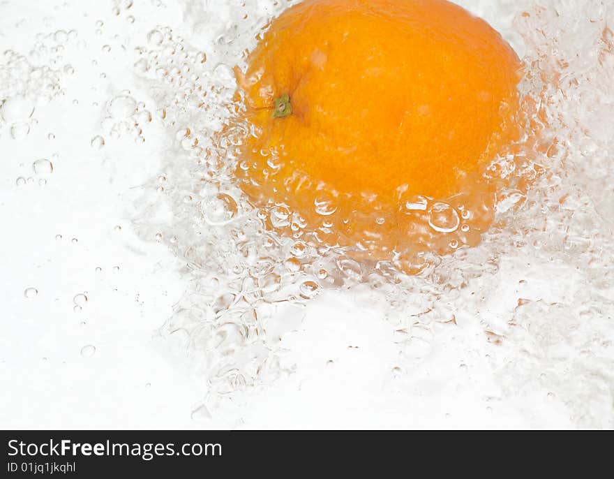 Fresh orange in streaming water. Fresh orange in streaming water.