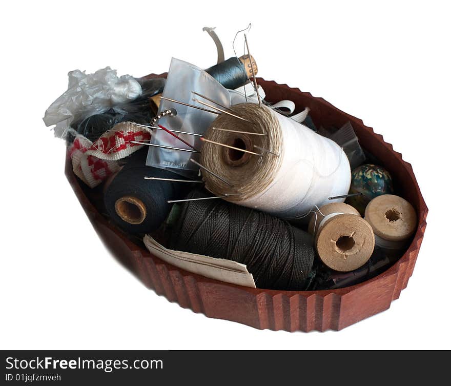 Thread and needle box on white background, isolated