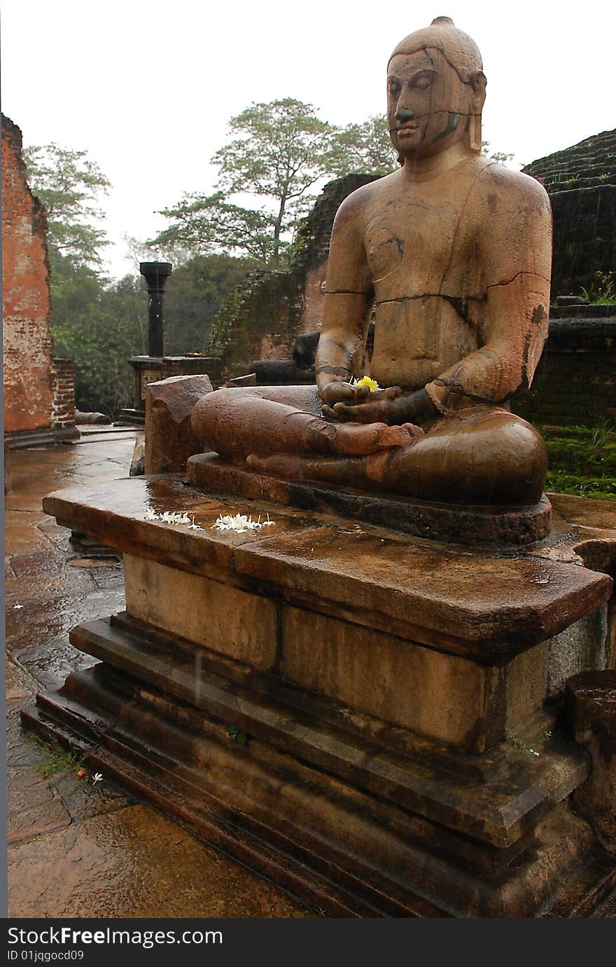 Four seated Buddhas are located in the Vatadage ancient house of relic in Polonnaruwa, Sri Lanka. One of them is shown in the picture. Four seated Buddhas are located in the Vatadage ancient house of relic in Polonnaruwa, Sri Lanka. One of them is shown in the picture.