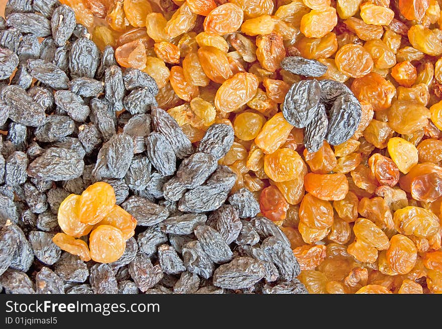 Juicy yin yang raisins, two-colour food background