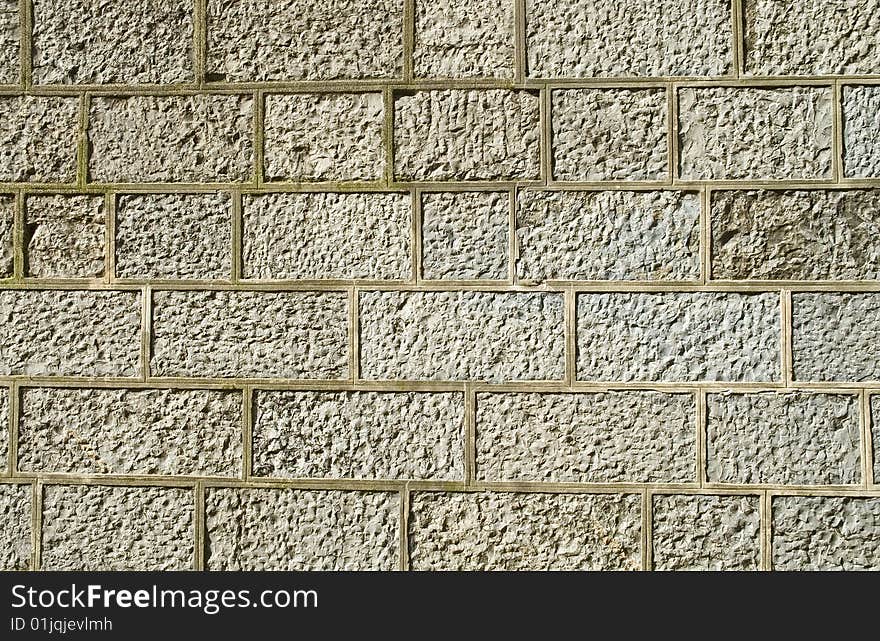 Old granite Stone brick wall in city. Old granite Stone brick wall in city