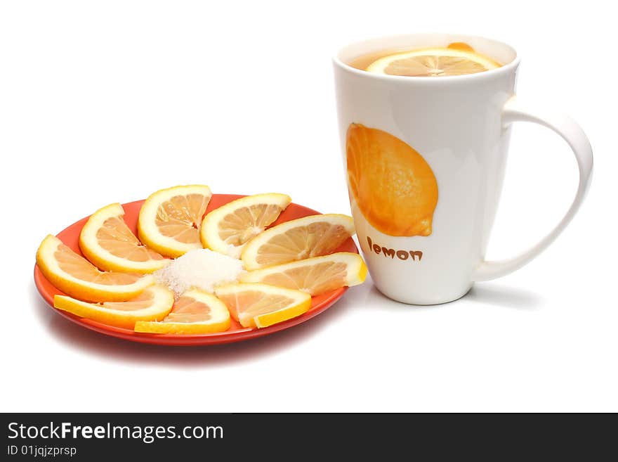 Tea in cups and lemon isolated on white background