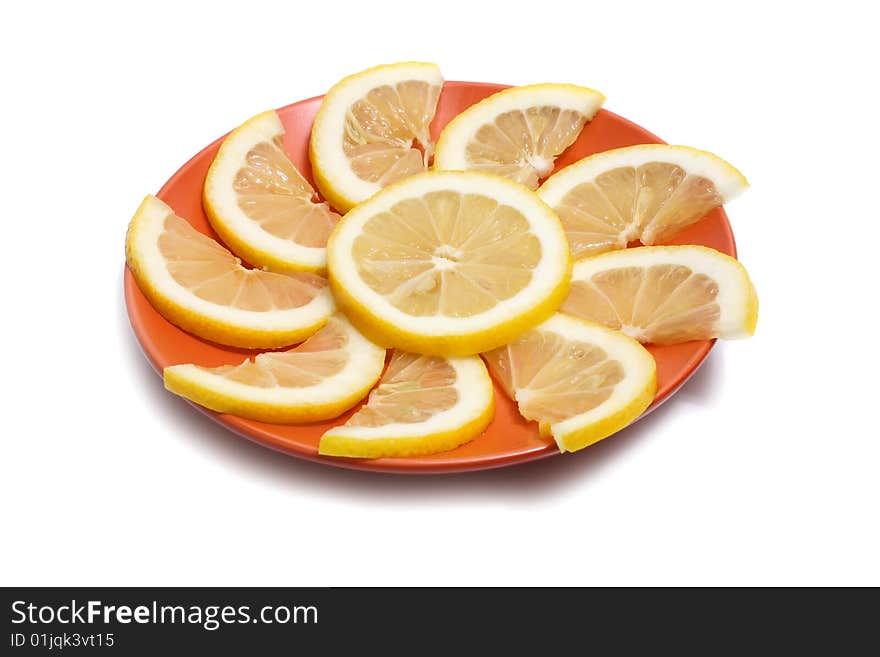 Lemon in plate isolated on white background