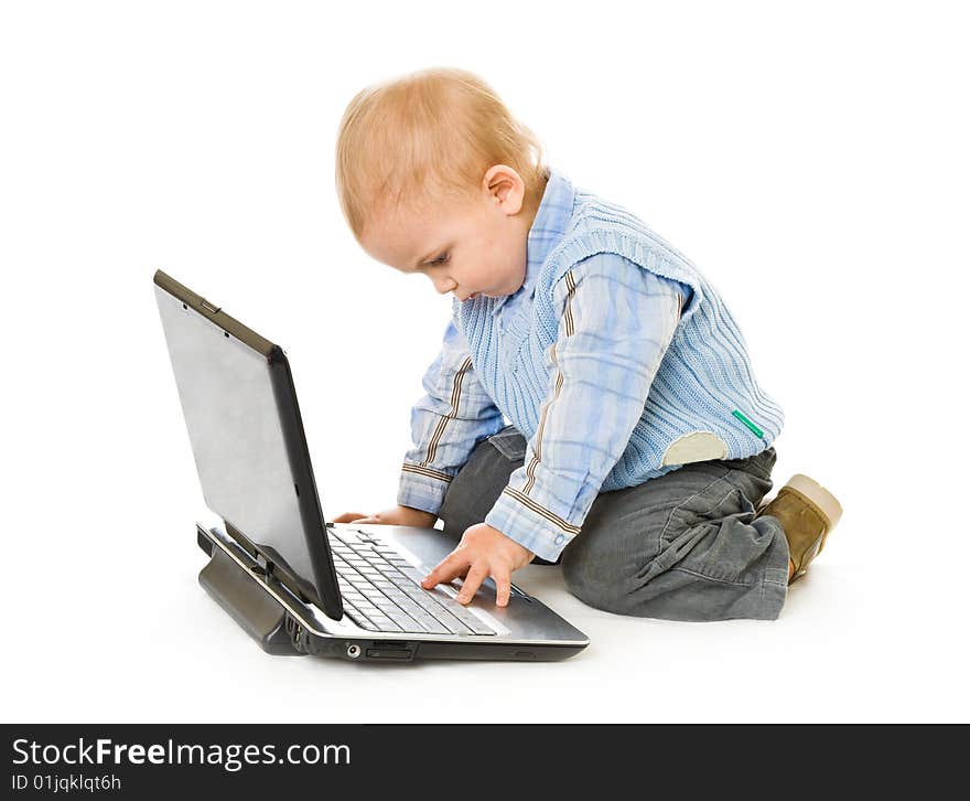 Concept of little businessman. Little child and laptop. Isolated on white background