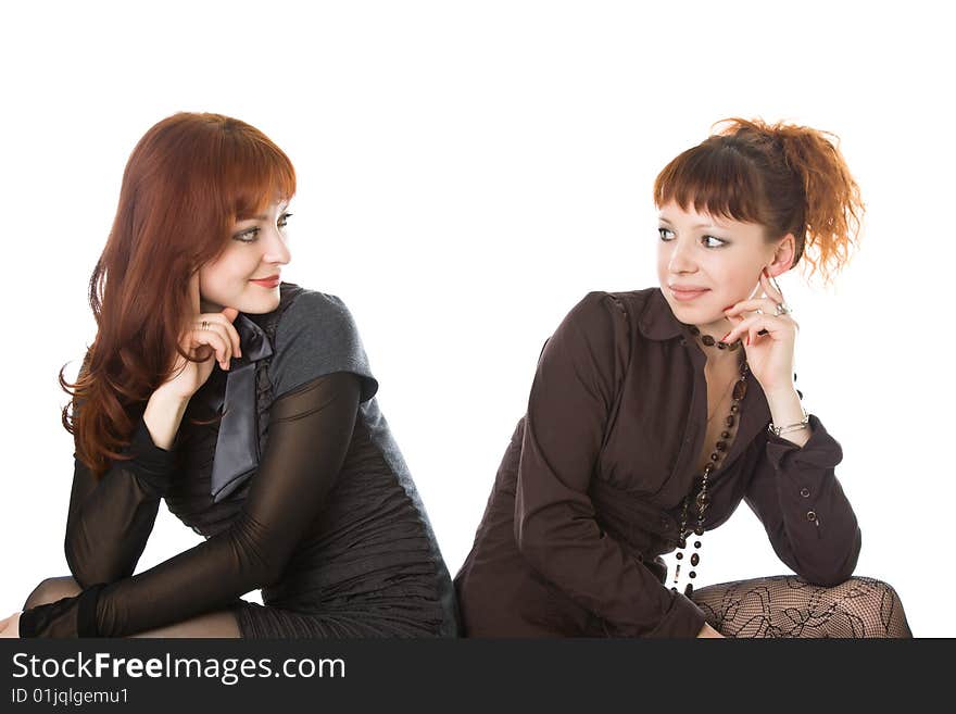 Two sitting girls. Isolated on white background. Two sitting girls. Isolated on white background