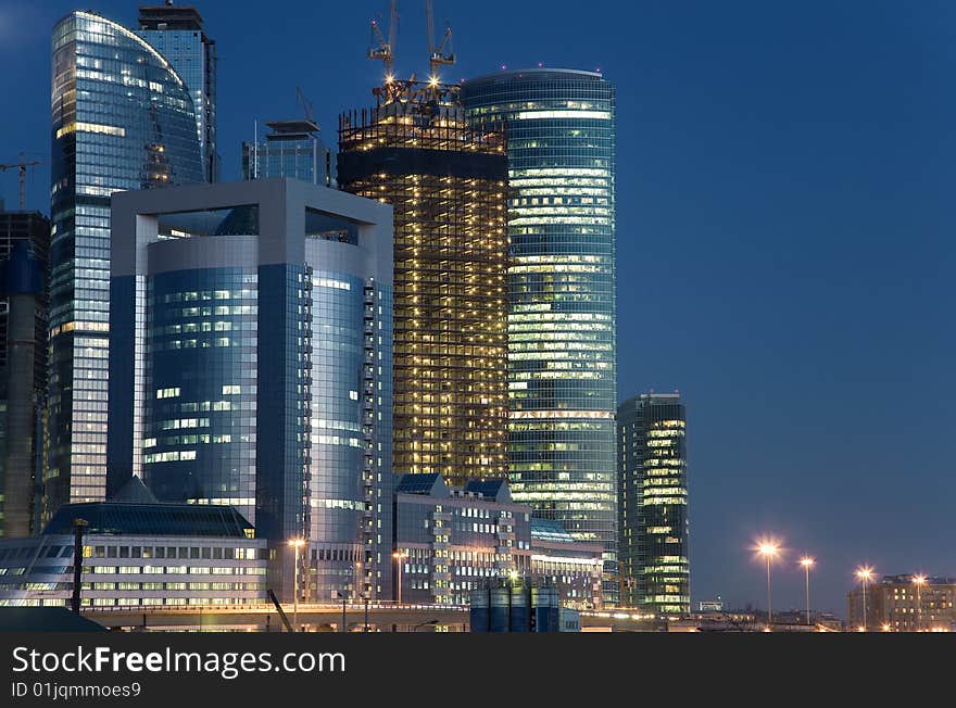 Several high office buildings, lighted, night scene. Several high office buildings, lighted, night scene