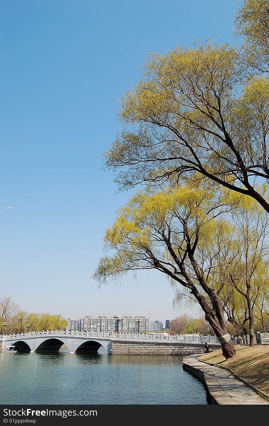 Lake with stone bridge and willows at the bank, shot at Tao ran park in spring, Beijing. Lake with stone bridge and willows at the bank, shot at Tao ran park in spring, Beijing.