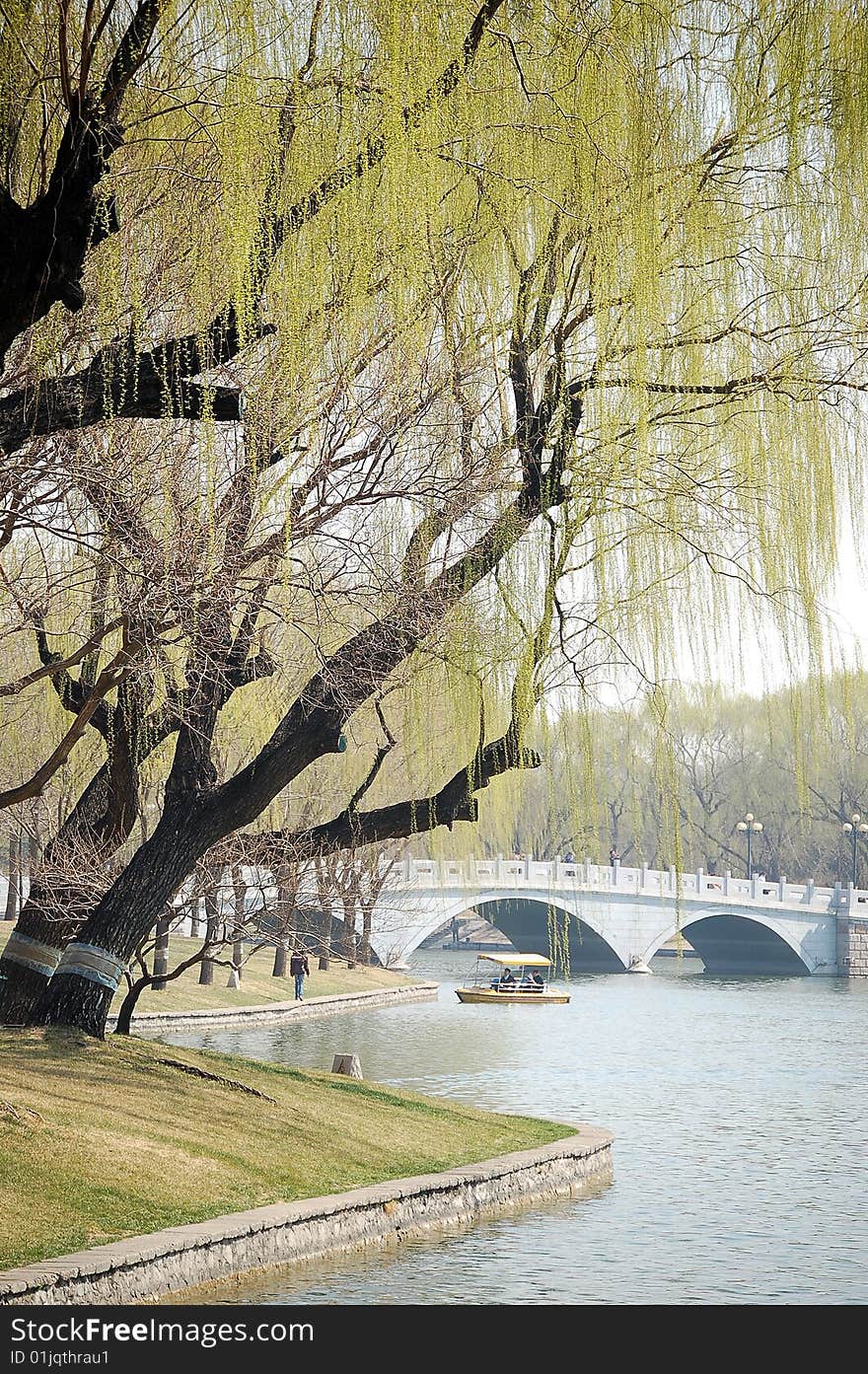 Lake with stone bridge and willows at the bank, shot at Tao ran park in spring, Beijing. Lake with stone bridge and willows at the bank, shot at Tao ran park in spring, Beijing.