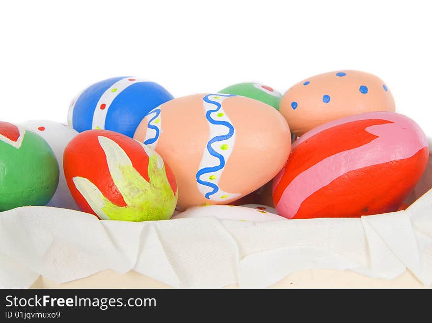 Child colored easter eggs in a box